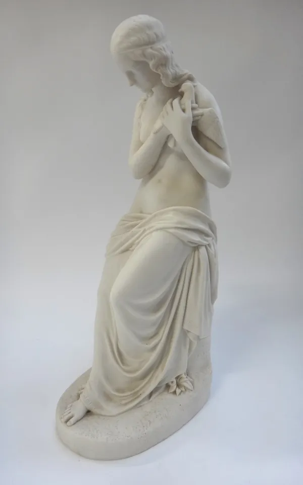 A Copeland parian figure of  'Innocence' by J.H. Foley, circa 1847, semi nude female holding a dove on a naturalistic oval base. Impressed marks, 42.5