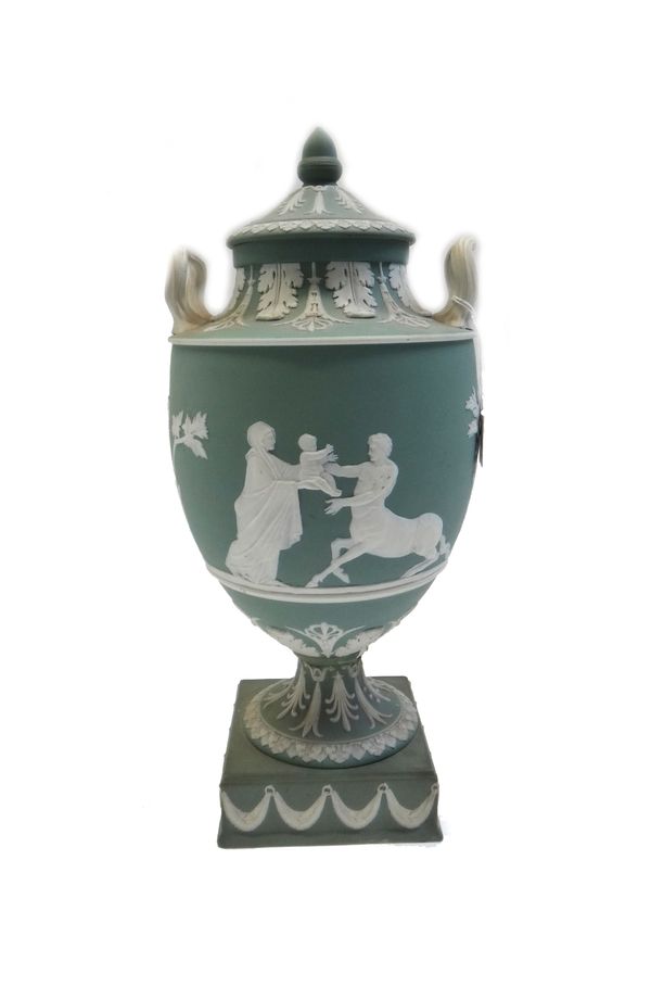 A Wedgwood green jasper urn and cover, late 19th century,  decorated with applied centaur and further classical figures, impressed 'Wedgwood' to the b