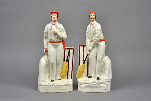 A pair of Staffordshire pottery figures of cricketers, circa 1860-65, believed to represent George Parr and Julius Caesar, modelled standing wearing c