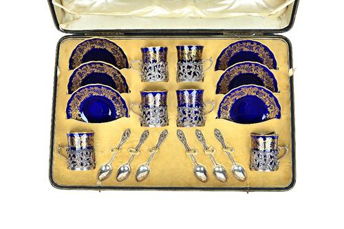 A Coalport gilt blue six piece silver mounted coffee set, hallmarked Goldsmiths & Silversmiths, London 1905, in a fitted case.  Illustrated