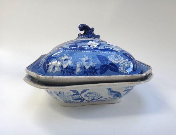 A pair of Ridgway blue and white printed earthenware tureens and covers from the `British scenery' series, circa  1820, each of canted square form wit