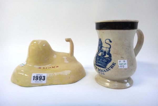 An unusual 'Lion' pottery jelly mould, 19th century, yellow ground titles 'LION' (19cm wide), an 'Exact Measure' tankard dated 1826, a 19th century Co