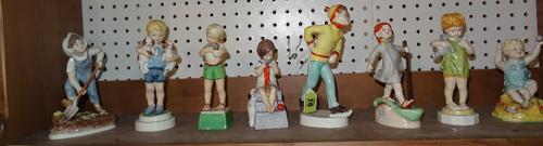 Eight Royal Worcester figures, comprising; 'Monday's Child is Fair of Face' (3519), 'Wednesday's Child Knows Little Woe' (3521), 'Thursday's Child Has