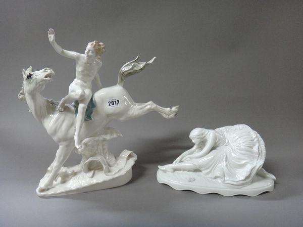 A Hutschenreuther porcelain model of a naked female atop a frolicking horse, incised 'K. Tutter', 36cm high, and a Rosenthal porcelain white glazed mo