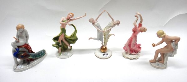 A Hutschenreuther Art Deco porcelain figure group, modelled with two female dancers atop a gilt ball, 23.5cm high, and four further Continental porcel