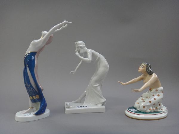 Three Rosenthal porcelain Art Deco figures, each modelled in the Egyptian taste, comprising; a white glazed 'Snake Charmer', 19.5cm high, and two furt