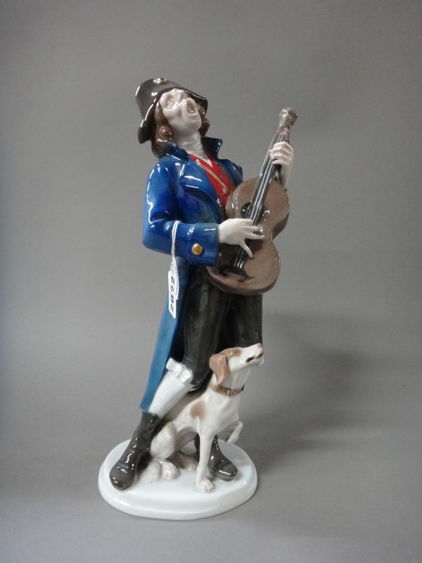 Karl Himmelstoss (1878-1967) for Rosenthal, a porcelain naval figure playing a guitar with a dog at his feet, signed 'K. Himmelstoss', green printed m