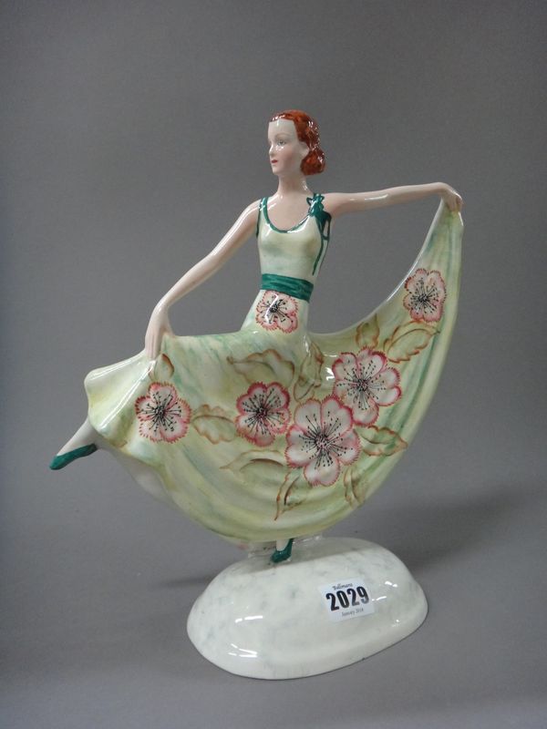 A Myott & Sons Goldscheider pottery figure, circa 1930, modelled as a female Art Deco dancer, in a green floral dress, 31cm high.