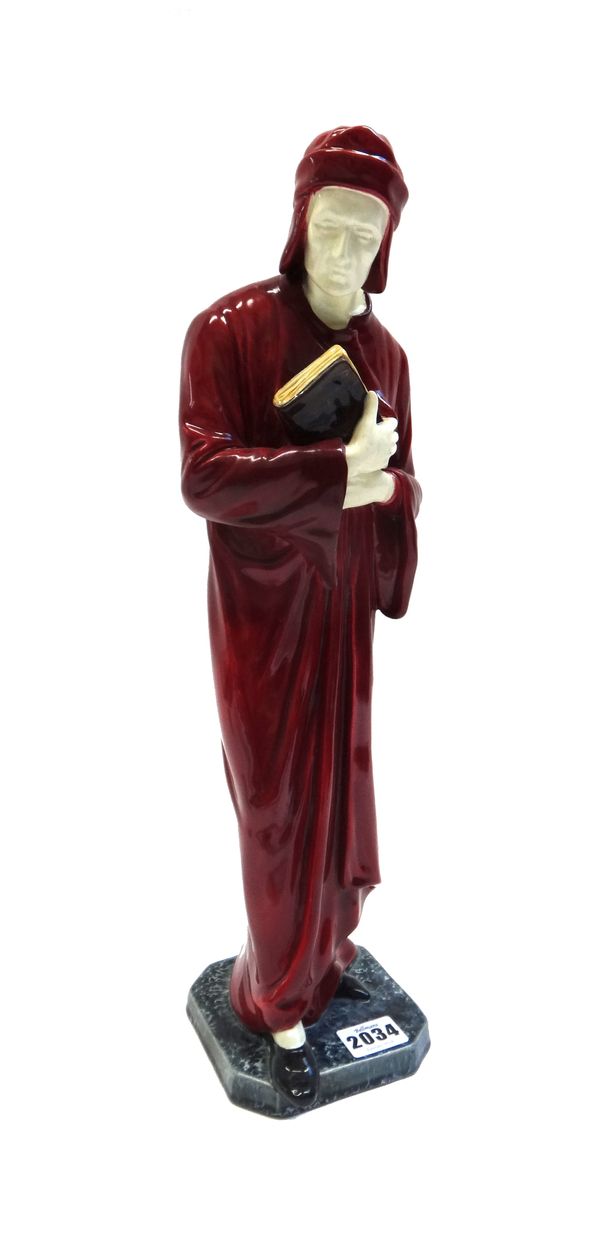 A Wiener Werkstatte figure, circa 1930, depicting a Cardinal in a long red gown and hat, clutching a book, indistinct impressed marks (a.f), 44cm high