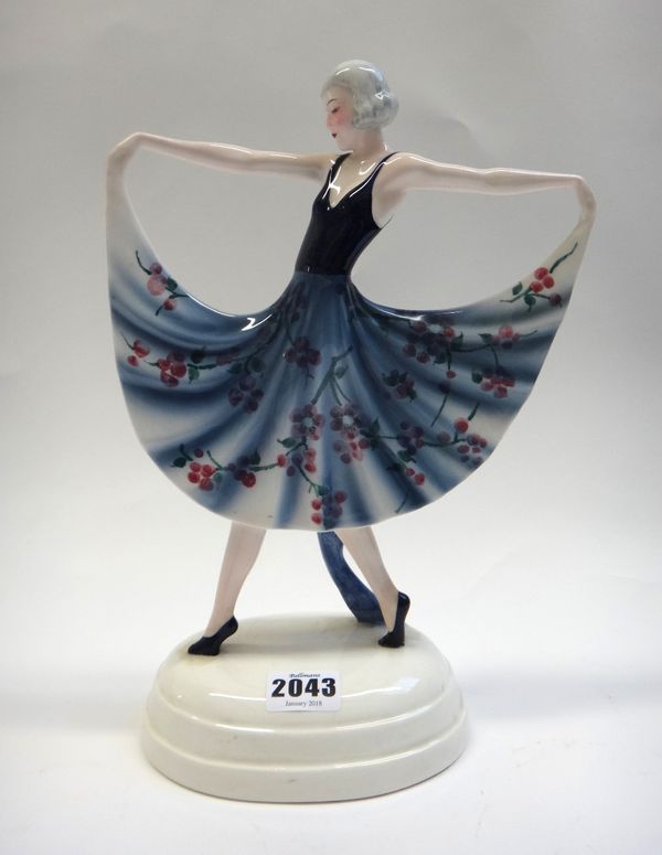 A Goldscheider  figure, circa 1930, modelled as an Art Deco female dancer in a floral print dress, impressed '6207/15/6', with black printed marks (a.