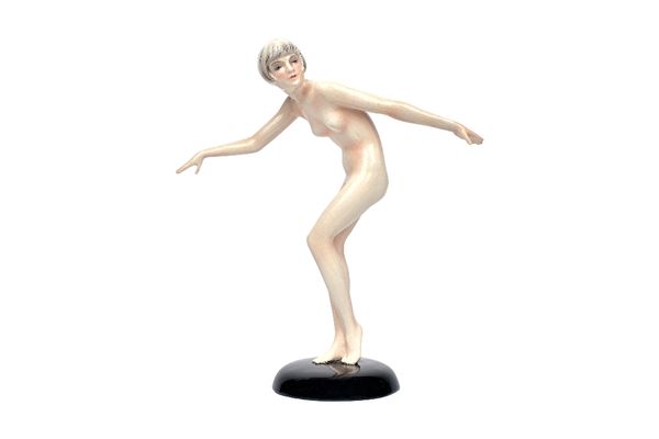 Lorenzl for Goldscheider; a pottery figure of a posed female nude, circa 1926, with Art Deco styling to her hair, on a black circular base, black prin