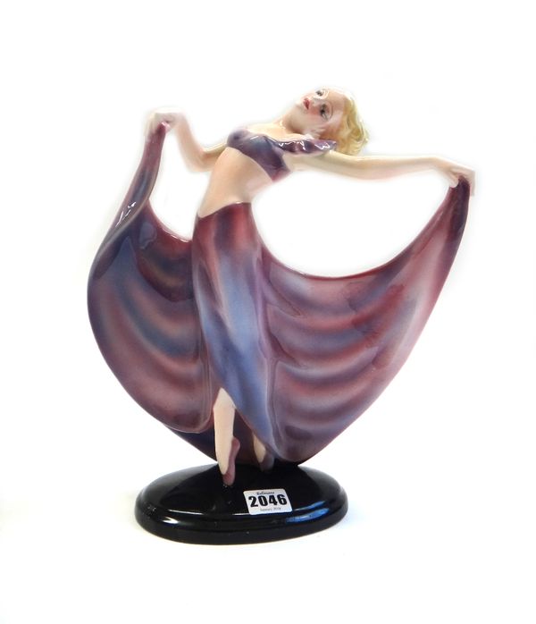 A Keramos Austrian figure, circa 1930, modelled as a female dancer in a long flowing purple dress, impressed '1445R' and with black printed marks (a.f