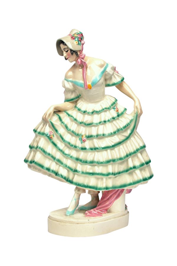 A Keramos Austrian pottery figure, 'Junge Frau im Kleid' (Young Woman in a Dress), circa 1920, printed and painted mark 'R17', 40cm high.  Illustrated