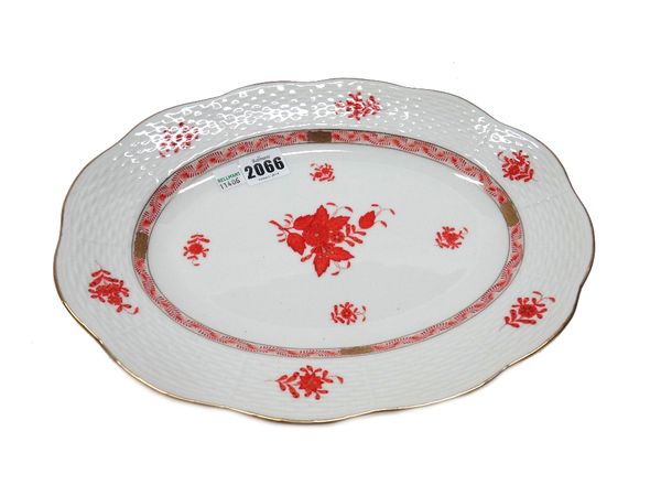 A Herend porcelain part dinner and teas service decorated in the Chinese Rust Bouquet pattern, comprising; two oval platters (37cm wide), two large bo