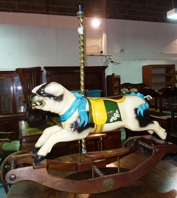 A 20th century Whittingham Horses Fairground child's pig rocking chair, 128cm wide.  F9