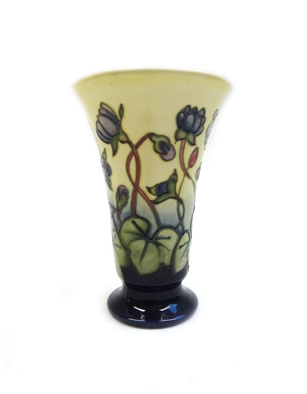 A Moorcroft 'Cyclamen' vase, circa 1999, tube line decorated against a yellow and blue ground, painted and printed marks, 15.5cm high, boxed.