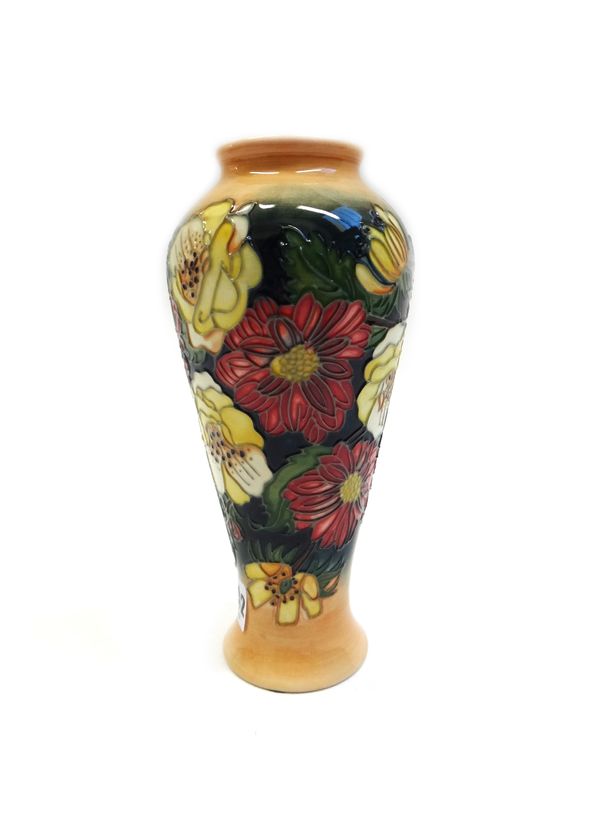 A Moorcroft 'Dahlia' vase by Emma Bossons, circa 1997, tube line decorated against a baluster ground, with printed and painted marks, 21cm high, boxed