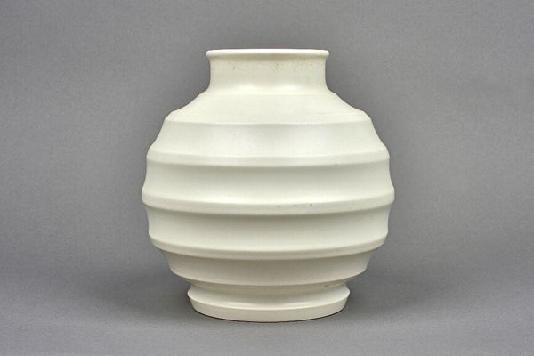 A Wedgwood 'Moonstone Football' vase by Keith Murray, circa 1935, with a fluted banded ovoid body and shallow collar neck, with printed marks, 18cm hi