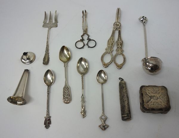 Silver, comprising; a pair of scissor action sugar nips, circa 1800, a small toddy ladle, the handle with pierced and beaded decoration, in the Arts &