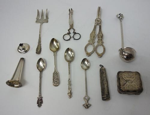 Silver, comprising; a pair of scissor action sugar nips, circa 1800, a small toddy ladle, the handle with pierced and beaded decoration, in the Arts &