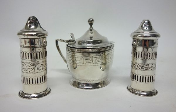 A George III silver oval hinge lidded mustard pot, engraved with a Greek key pattern border, maker Andrew Fogelberg, London 1805 and a pair of silver