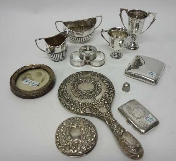 Silver and silver mounted wares, comprising; a Victorian twin handled sugar bowl, with a matching milk jug, London 1894, two twin handled trophy cups,