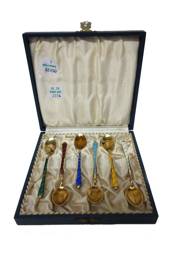 A set of six Danish silver gilt and vary coloured enamelled coffee spoons, detailed 'Ela Denmark Sterling' and a set of six Danish silver gilt and var