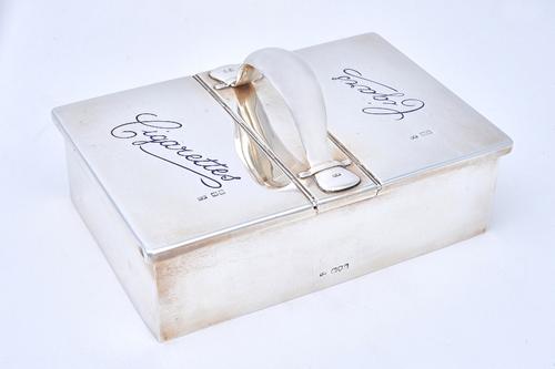 A silver and blue enamelled rectangular twin compartment cigarettes cum cigars box, wooden lined within the two compartments, the centre with a carryi