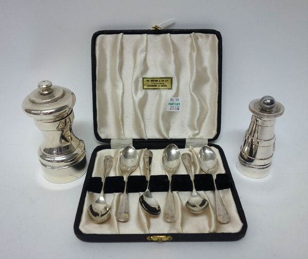 A set of six silver coffee spoons, Sheffield 1961, with a case, a silver mounted peppermill and a smaller plated peppermill, (3).