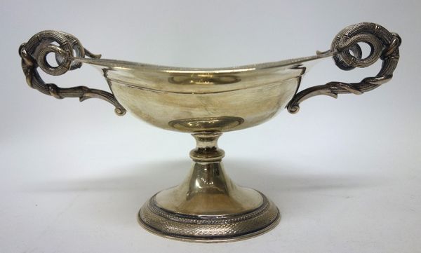 A European twin handled pedestal tazza, of ovoid form, having scrolling handles and decorated with an engine turned border to the top and to the oval