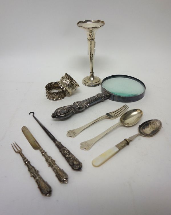 Silver and silver mounted wares, comprising; two napkin rings, a small trumpet shaped vase (loaded), a christening spoon and fork, a rat tail pattern