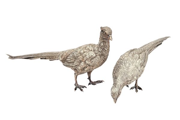 A pair of silver models of a cock and a hen pheasant standing, London 1987, maximum length 27.5cm, combined gross weight 928 gms, (2).  Illustrated