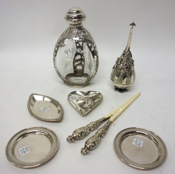 A silver heart shaped trinket dish, Birmingham 1987, a silver boat shaped trinket dish, Birmingham 1989, a pair of silver mounted ivory glove stretche