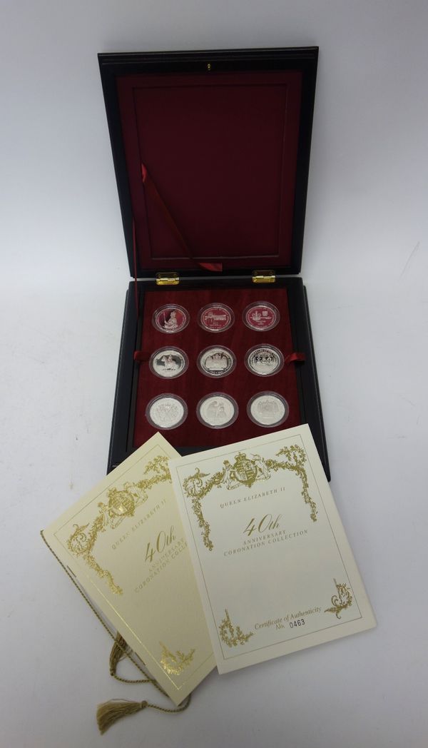 A Queen Elizabeth II 40th Anniversary Coronation Crown Collection, comprising; eighteen crown sized silver proof commemorative coins, with a display b