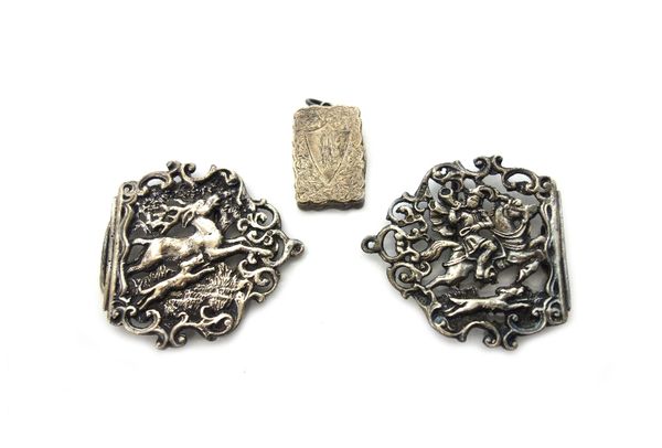 A late Victorian silver shaped rectangular vinaigrette, with a scroll pierced and gilt grille, the exterior with foliate engraved decoration and monog