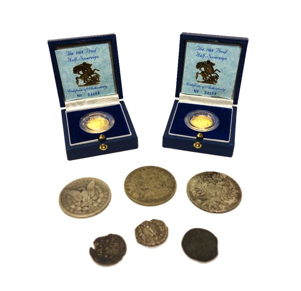 Two Elizabeth II 1988 proof half sovereigns, with Royal Mint cases, a U.S.A Morgan dollar 1886, a re-struck Maria Theresa dollar 1780 and four further