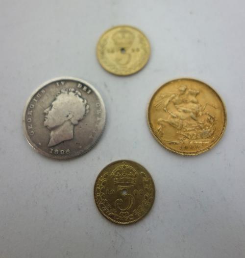 A Victoria old head sovereign, 1900, a George IV shilling, 1826 and two further items, (4).