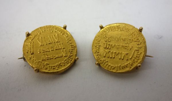 Two Islamic gold coins, individually mounted as brooches, combined weight 12.2 gms, (2).