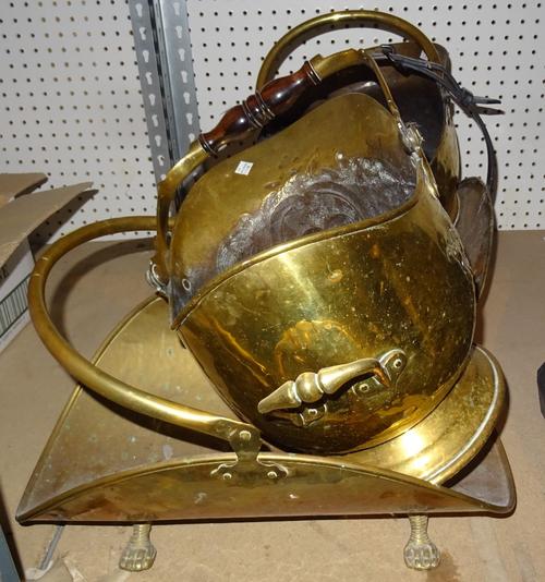 Two early 20th century brass coal scuttles and two brass log baskets, one with faux belt handle, (4). S4