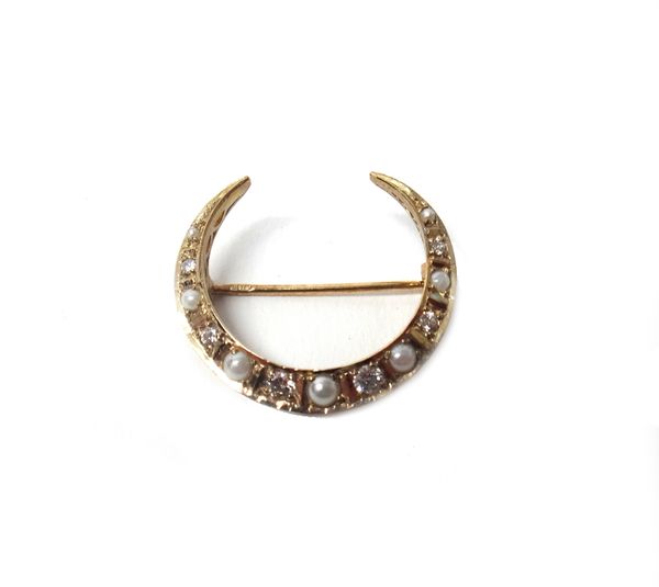 A 9ct gold, cultured pearl and diamond brooch, designed as a crescent, mounted with alternating cultured pearls and circular cut diamonds.