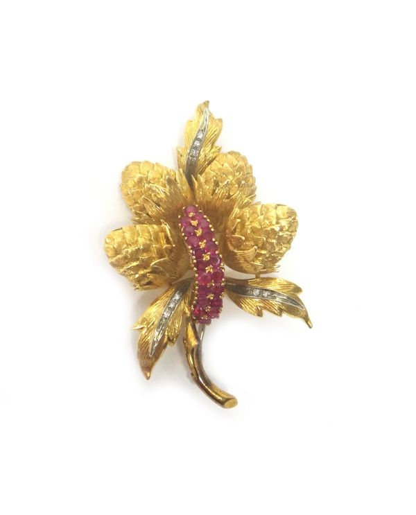 An Italian gold, ruby and diamond brooch, designed as a spray, mounted to the centre with two rows of circular cut rubies and with three rows of small