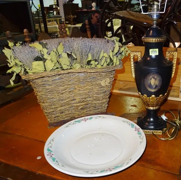 An early 20th century wicker basket with dried lavender, a black and gilt table lamp, and a circular Chinese plate, (3). K2