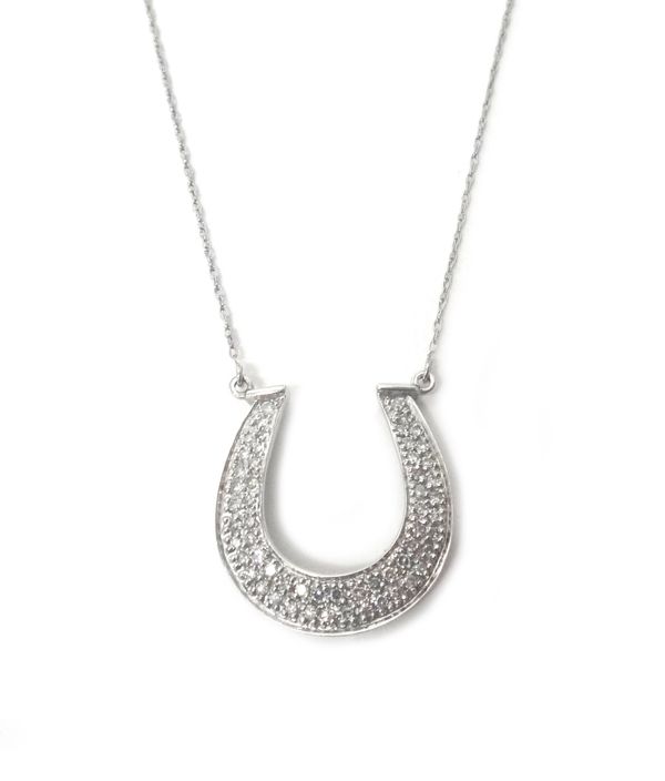 A 9ct white gold and diamond set pendant necklace, designed as a horseshoe, on a trace link neckchain, with a boltring clasp, detailed 10 K.