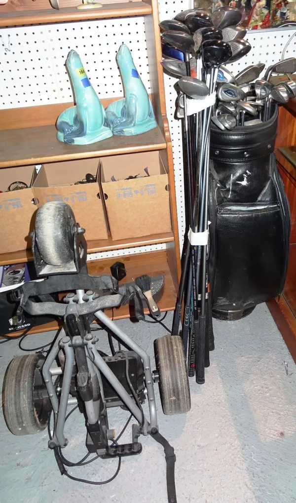 A quantity of 20th century golf clubs, mainly Callaway, to include a golf bag and trolley, (qty). CAB