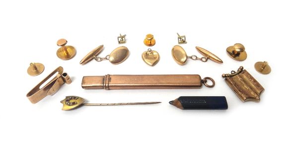 A gold slide action pencil case, a pair of gold cufflinks, having oval fronts and with torpedo shaped backs, a pair of earstud tops, a seed pearl and