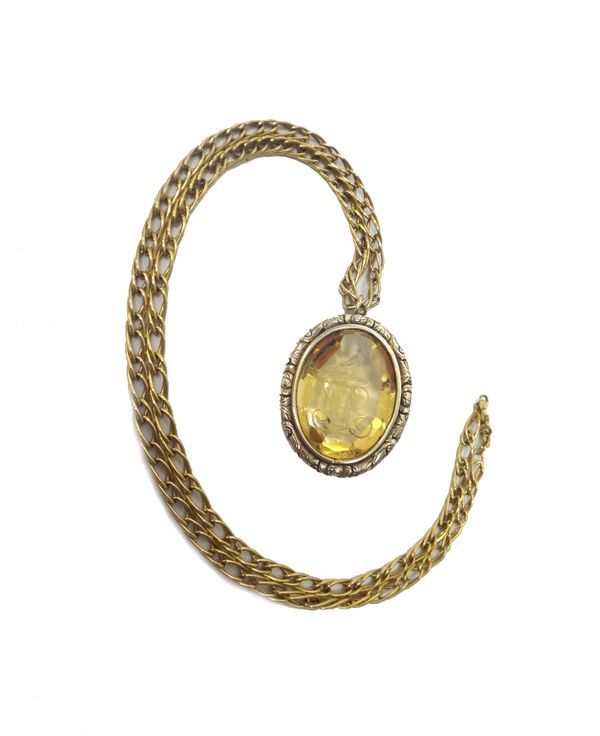 A citrine intaglio pendant (as converted from a Victorian brooch), the intaglio carved as the crest of a bird above a monogram, on a 9ct gold multiple