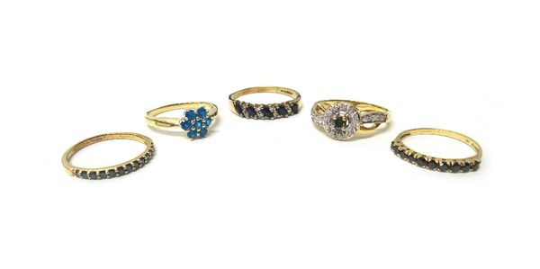 A 9ct gold, sapphire and diamond set half hoop ring, mounted with a row of five marquise shaped sapphires, in a slanting design, alternating with four