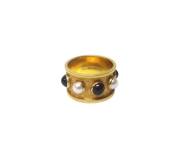 An 18ct gold, carbuncle garnet and cultured pearl set wide band ring, mounted with four carbuncle garnets, alternating with four half cultured pearls,