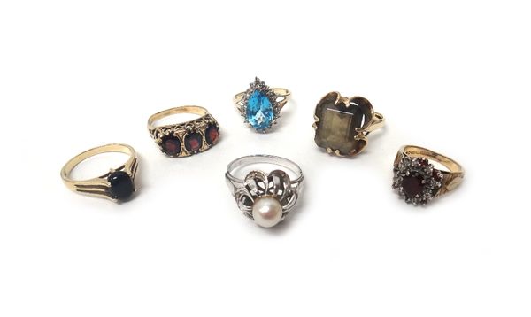 A cultured pearl and rose diamond set ring, in a pierced design, a gold and garnet set three stone ring, mounted with a row of oval cut garnets, a 9ct