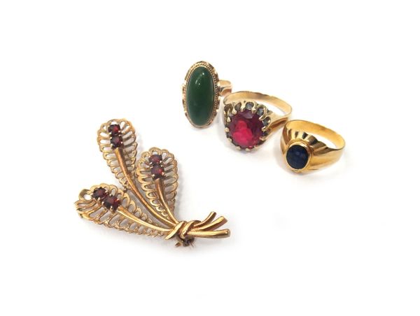 A 9ct gold and garnet set brooch, designed as a fern spray, mounted with six circular cut garnets, a gold and synthetic red gem set solitaire ring, de